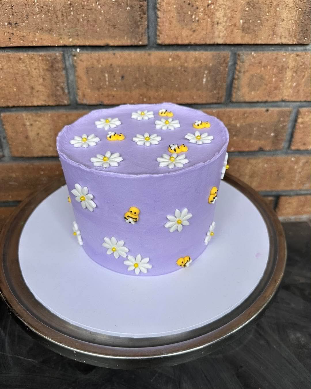 White birthday cake with blue and teal palette knife brushstroke panels, gold leaf accents and gold Happy Birthday hoop topper