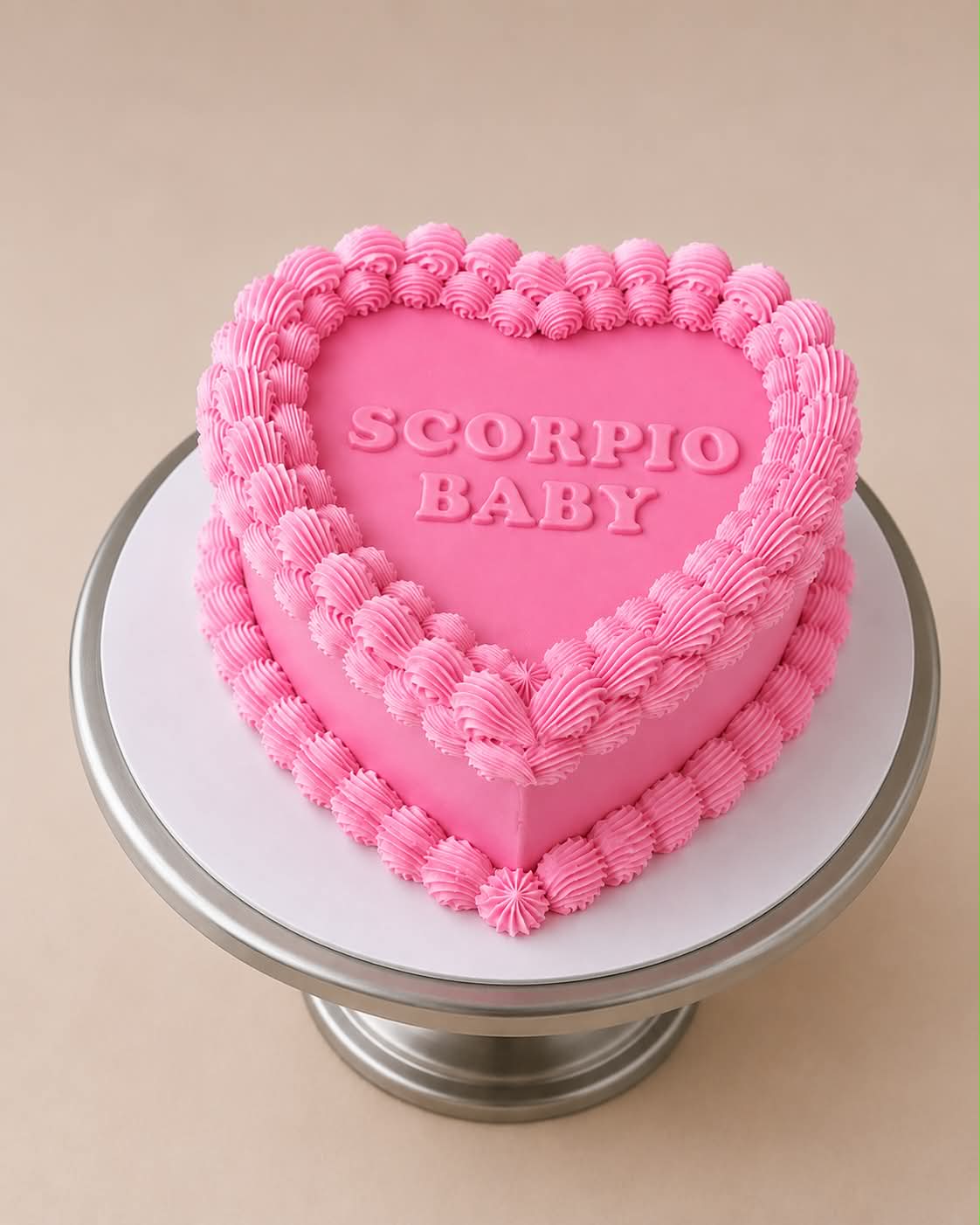 Red and pink heart cake with pearl decorations reading Libra Baby