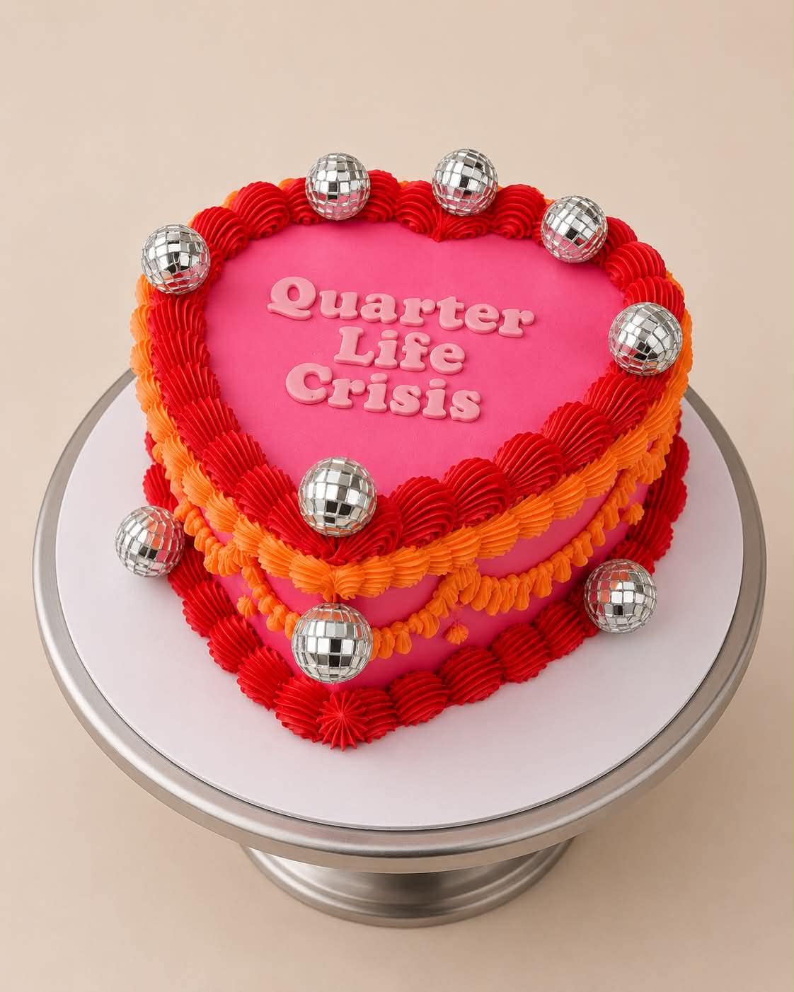 Electric blue heart cake with red glitter cherries on top