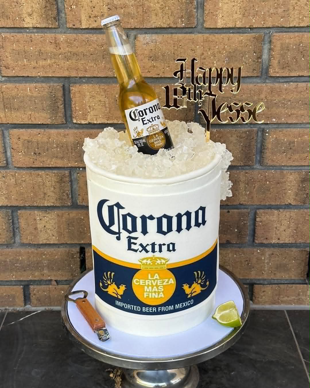 Tall white Corona Extra beer bucket birthday cake for Jesse's 18th with fondant Corona bottle, crushed rock sugar ice and lime wedge