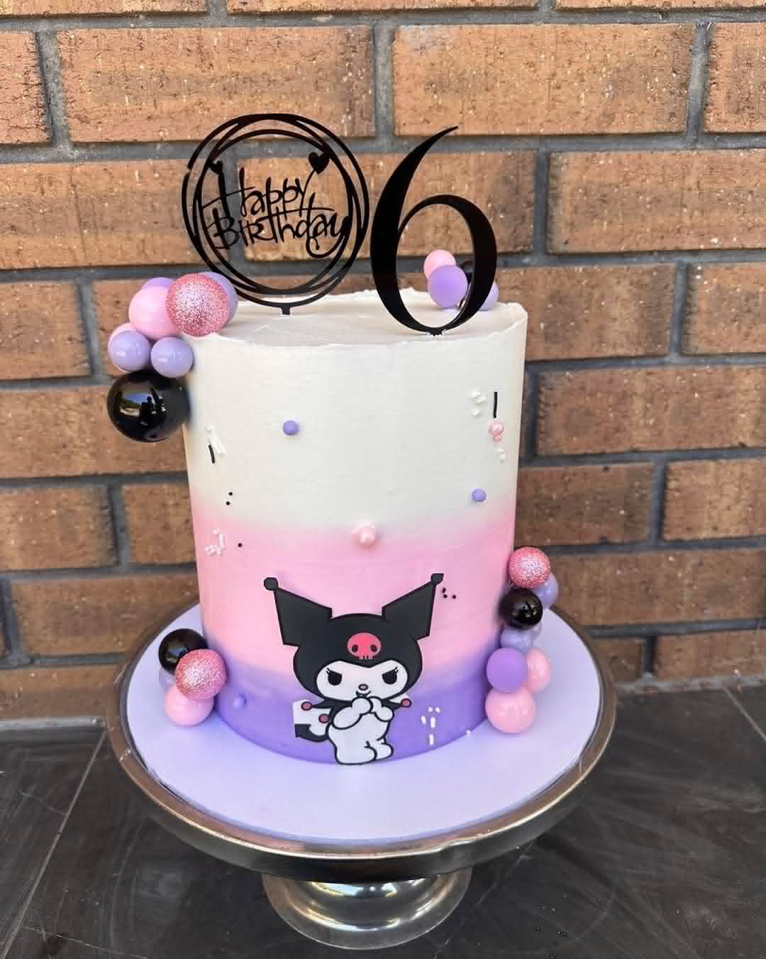 White to purple ombre Kuromi birthday cake for 6th birthday with pink and black ball clusters and Happy Birthday topper